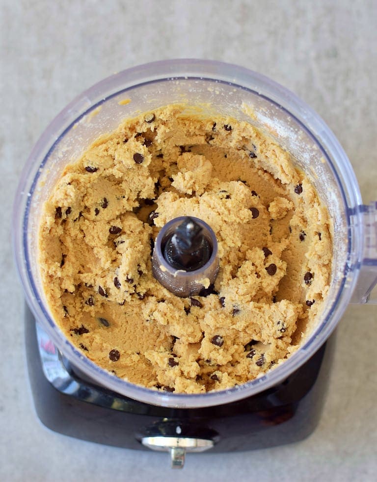 Vegan cookie dough with chocolate chips in a food processor