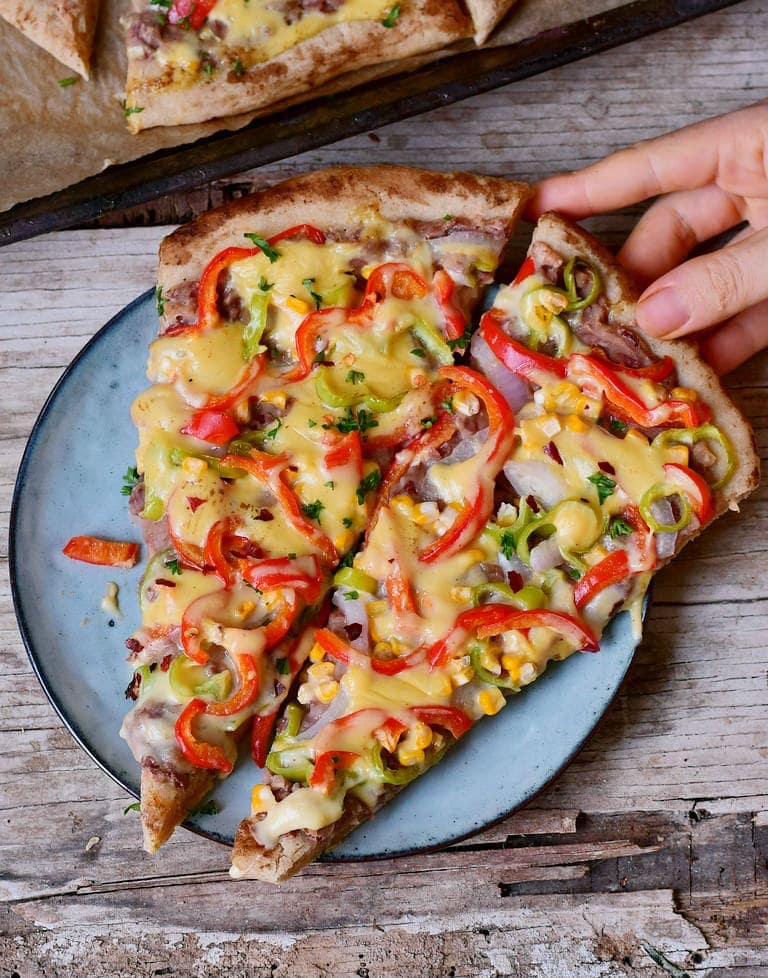 Mexican Pizza recipe with corn refried beans peppers and vegan cheese
