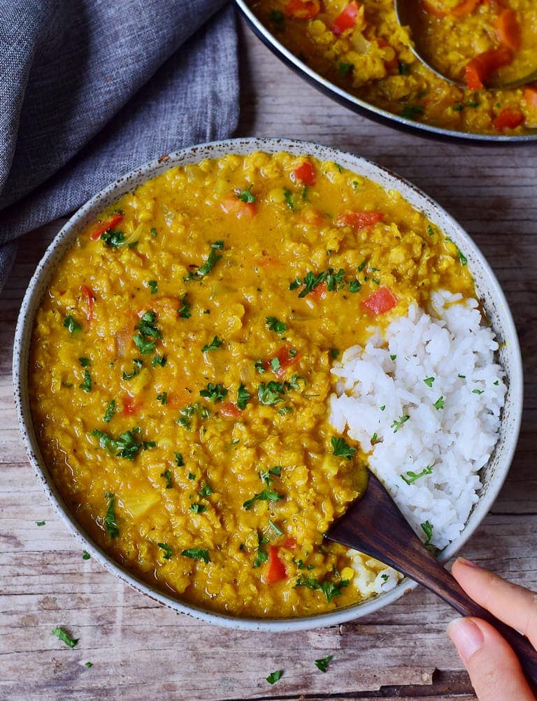 eating Indian Dal with rice in a bowl