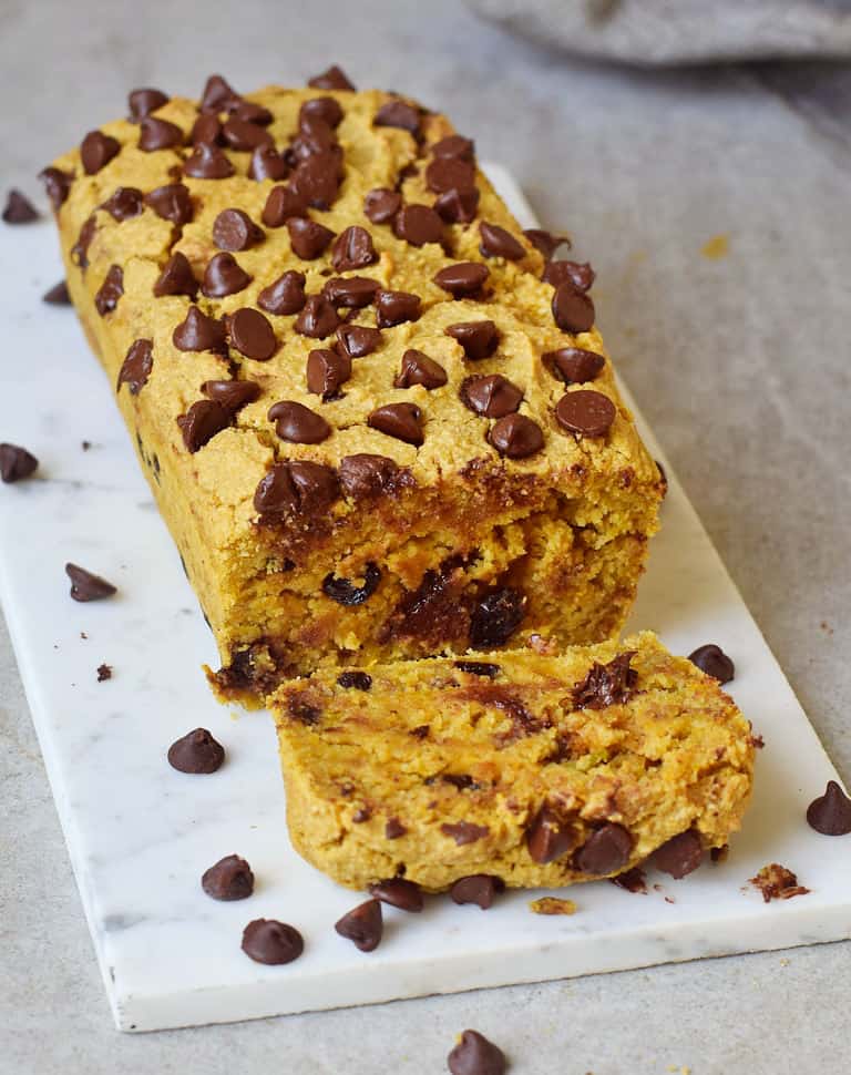 orange loaf with chocolate chips on marble board