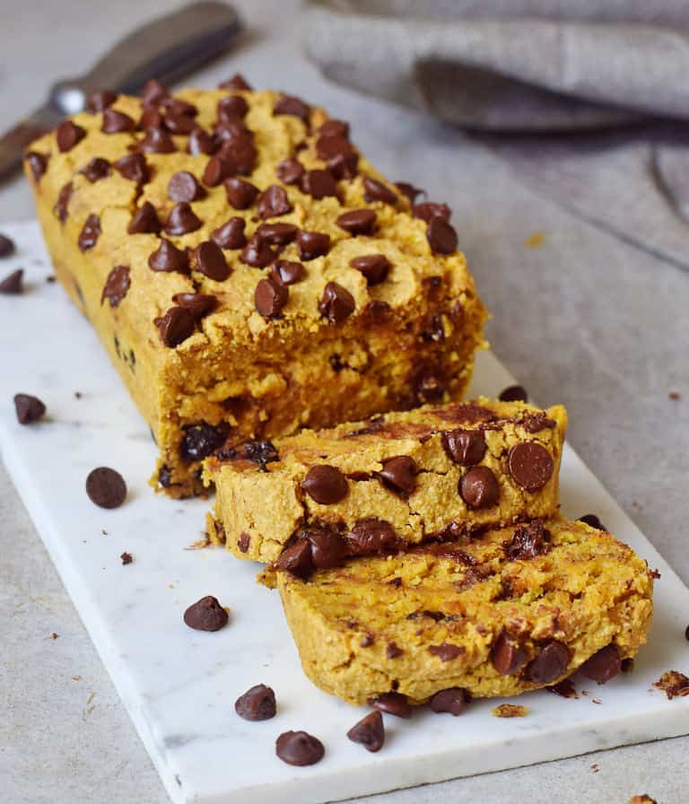 the best vegan chocolate chip pumpkin bread on a marble board