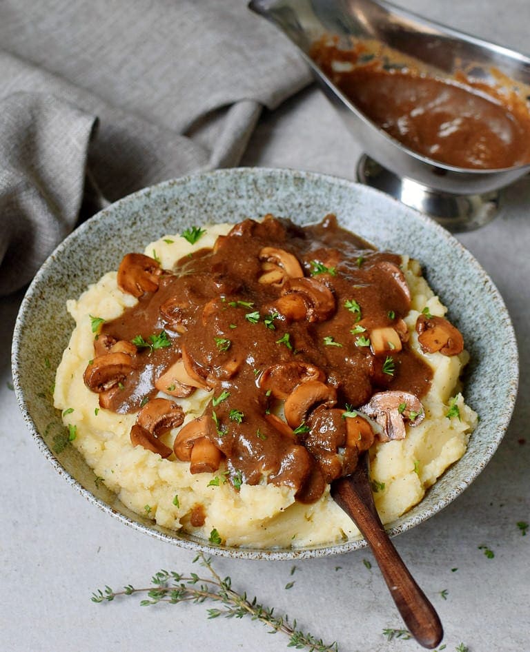 Bowl with mashed potatoes and vegan gravy
