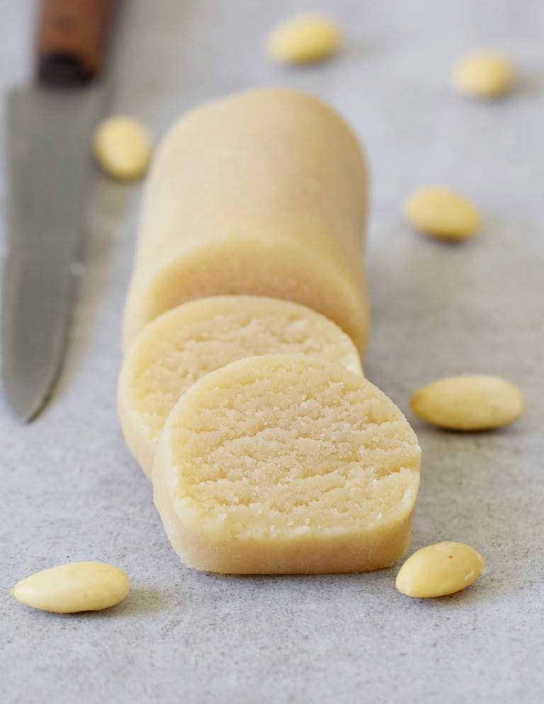log of homemade marzipan with blanched almonds