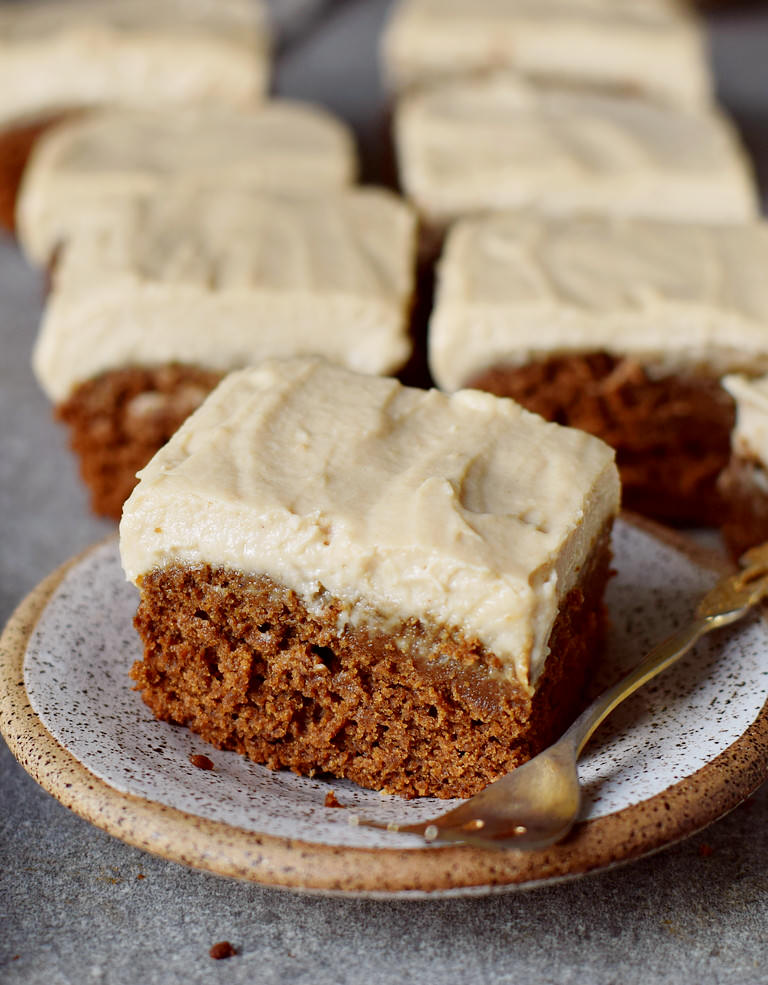 vegan gingerbread cake with sugar-free frosting on a small plate