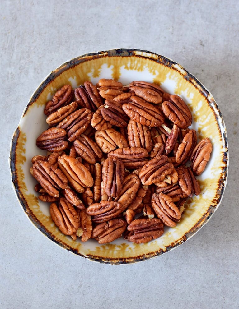 whole pecans in a bowl