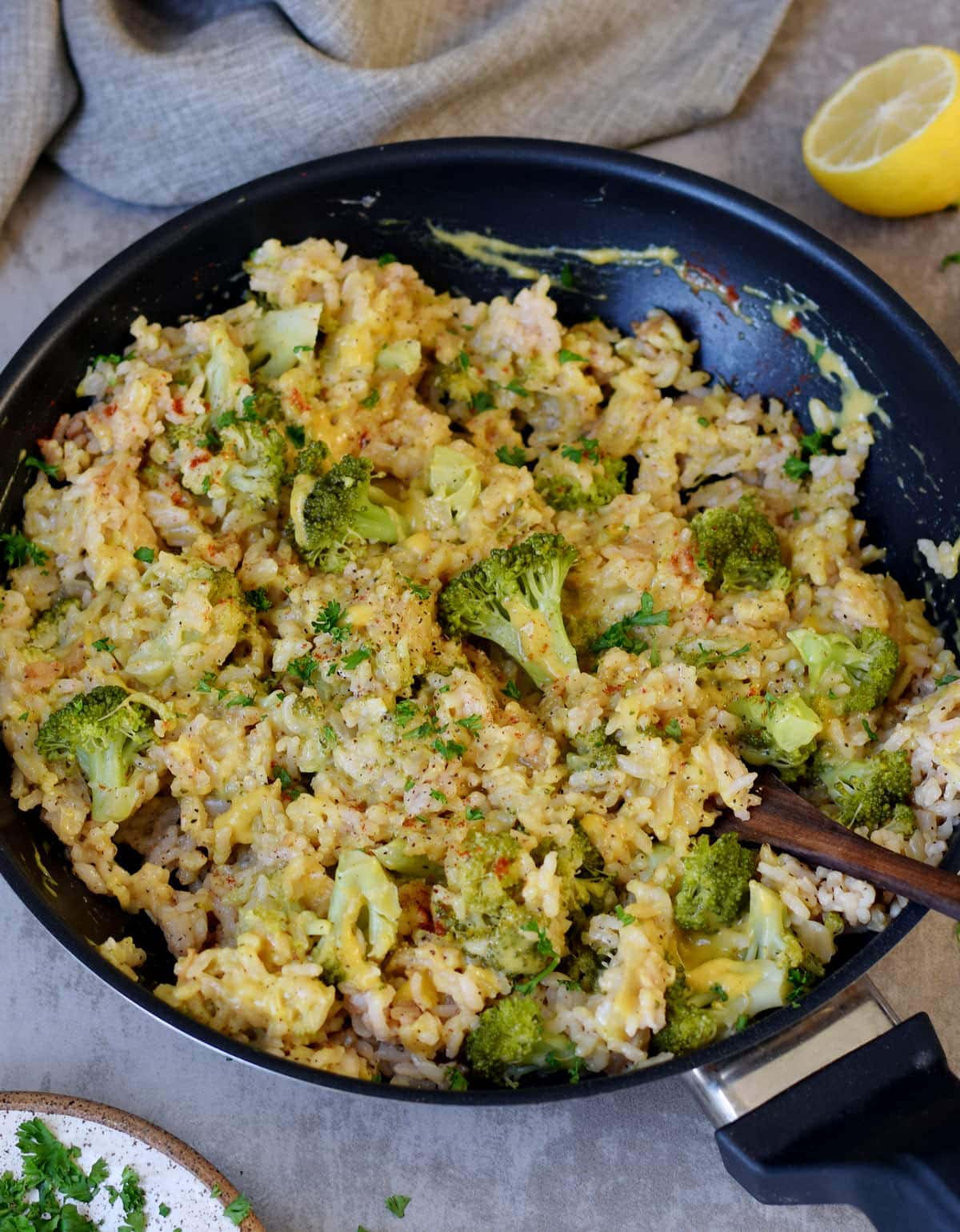 broccoli rice with veggie cheese in a skillet
