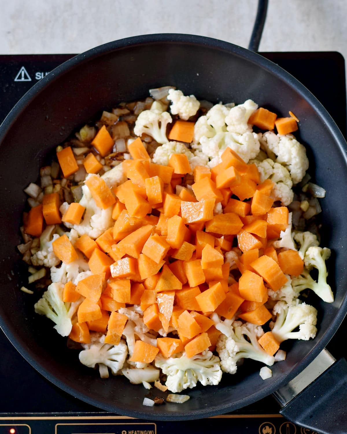 Carrot and cauliflower in a pan