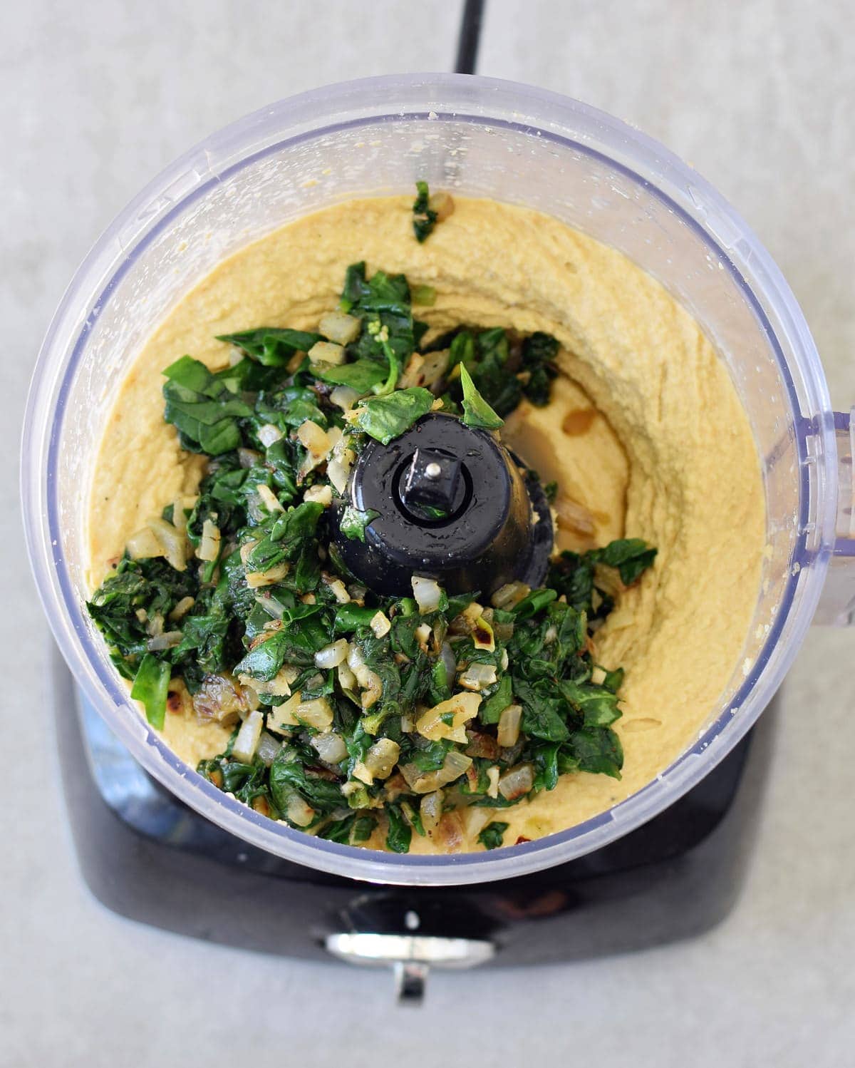 vegan ricotta and cooked spinach in a food processor
