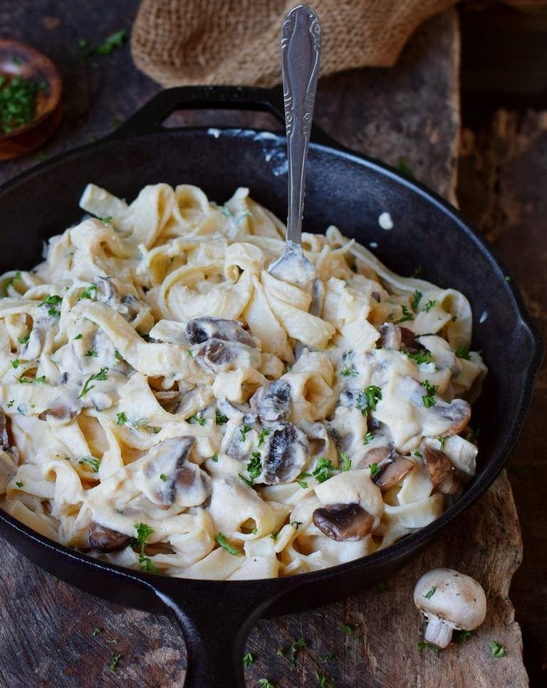 Best vegan Alfredo sauce with pasta and mushrooms in a skillet
