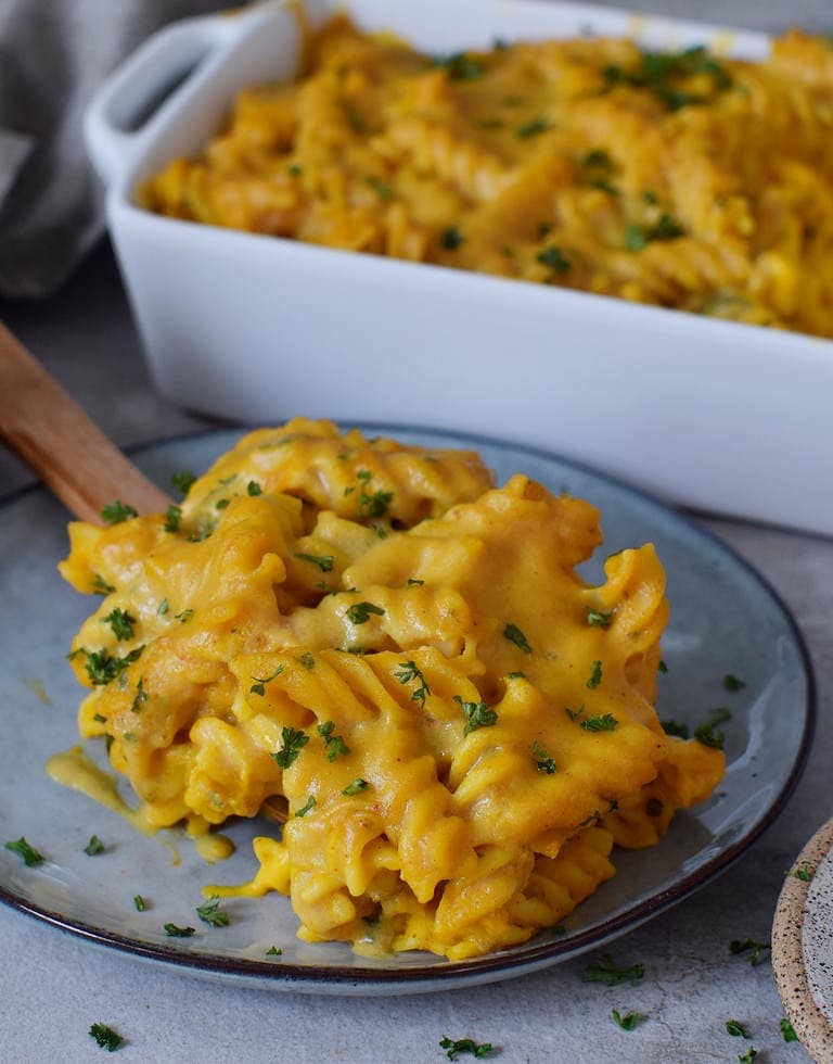 Pumpkin pasta bake with vegan cheese on a plate