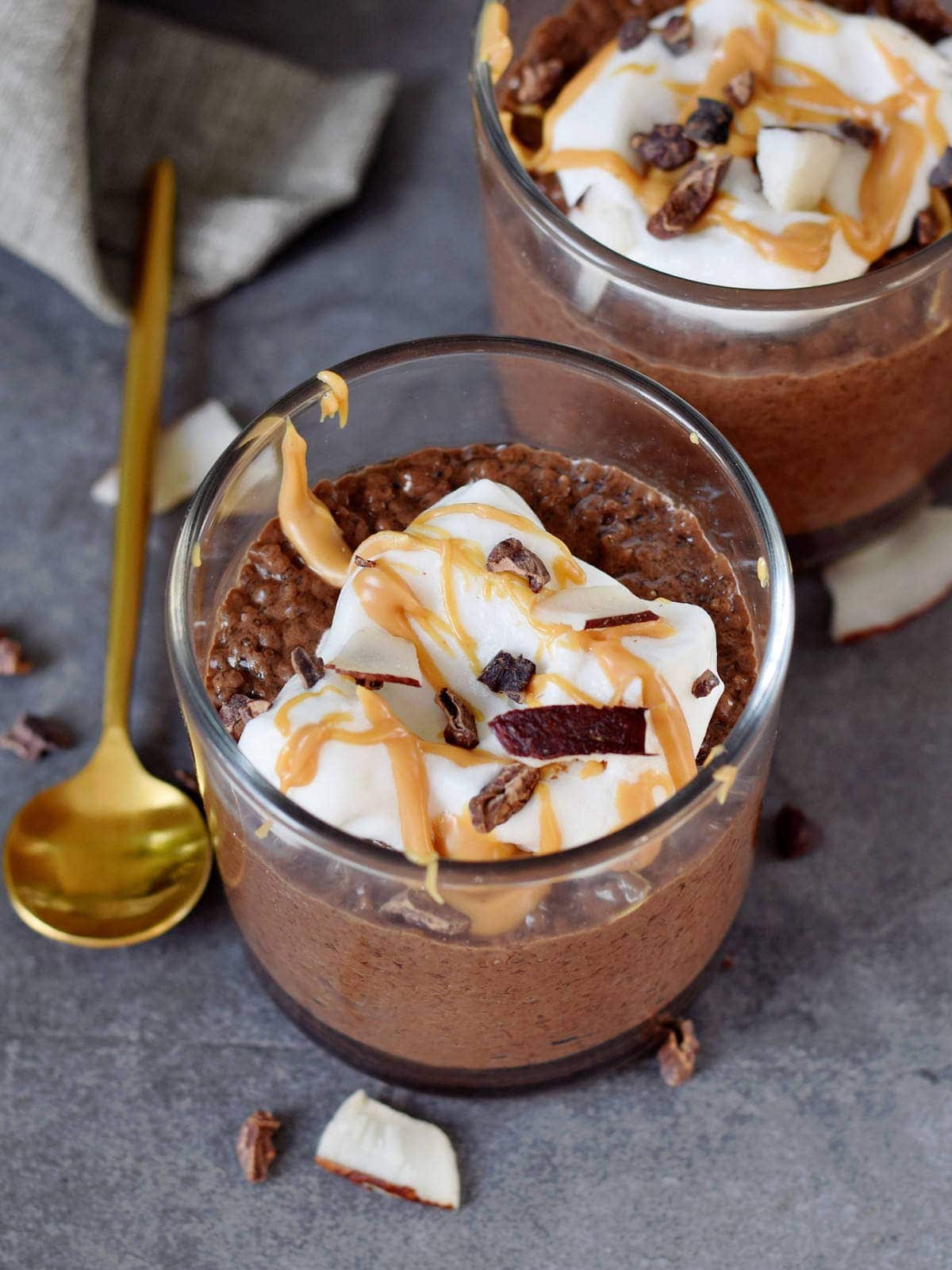chocolate keto chia pudding topped with coconut whip from above
