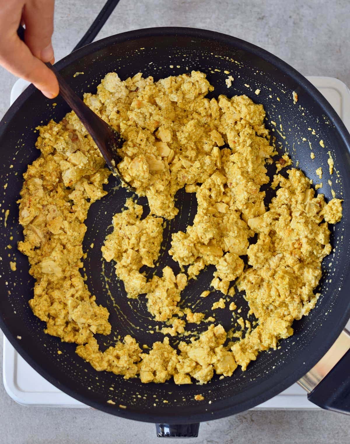 vegan scrambled eggs in a black pan