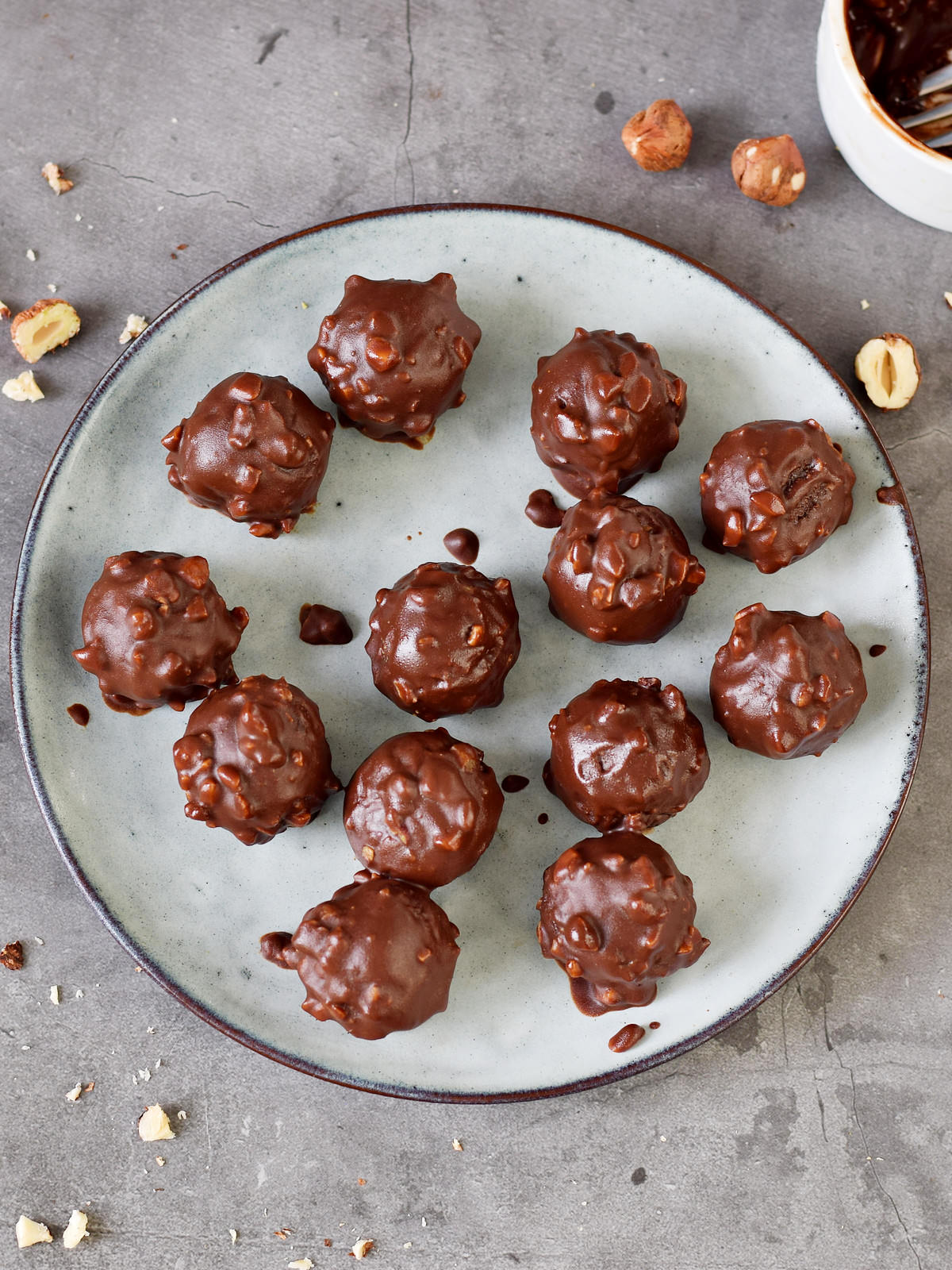 13 hazelnut chocolate balls on a plate