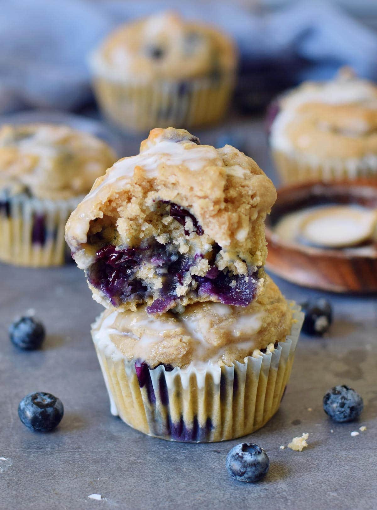a stack of two vegan blueberry muffins with sugar-free icing