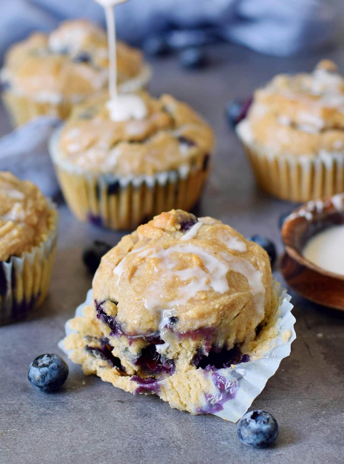 one cupcake with blueberries and sugar-free icing in front of others