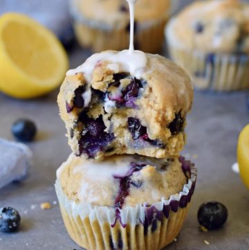 stack of two vegan blueberry muffins with sugar-free icing