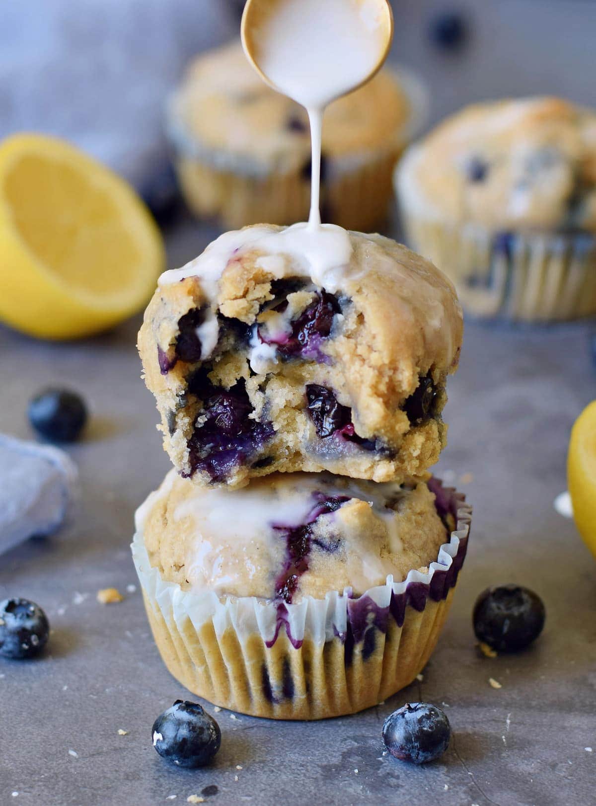 stack of two vegan blueberry muffins with sugar-free icing