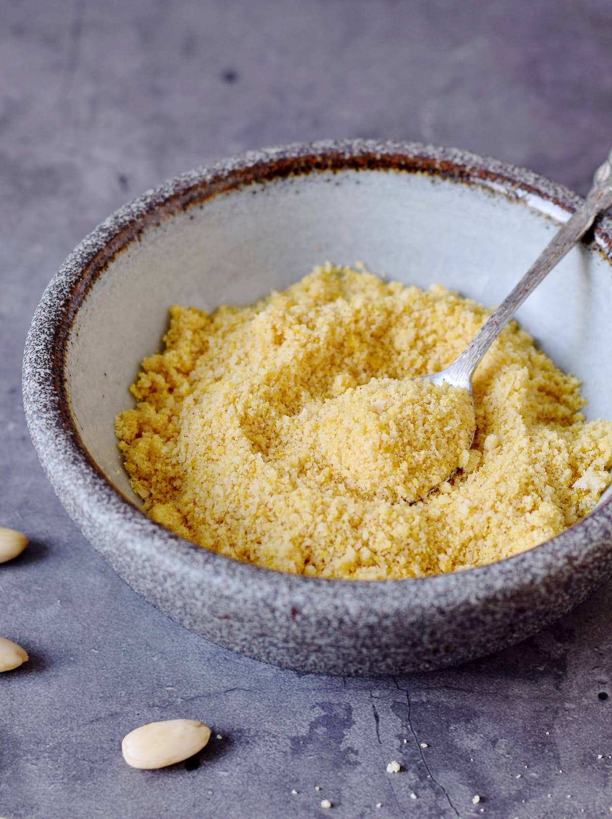 vegan parmesan cheese in a bowl with spoon