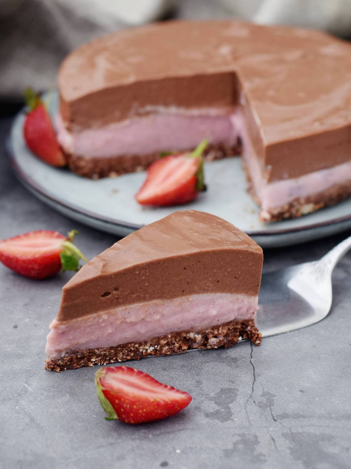 one piece of chocolate strawberry cheesecake