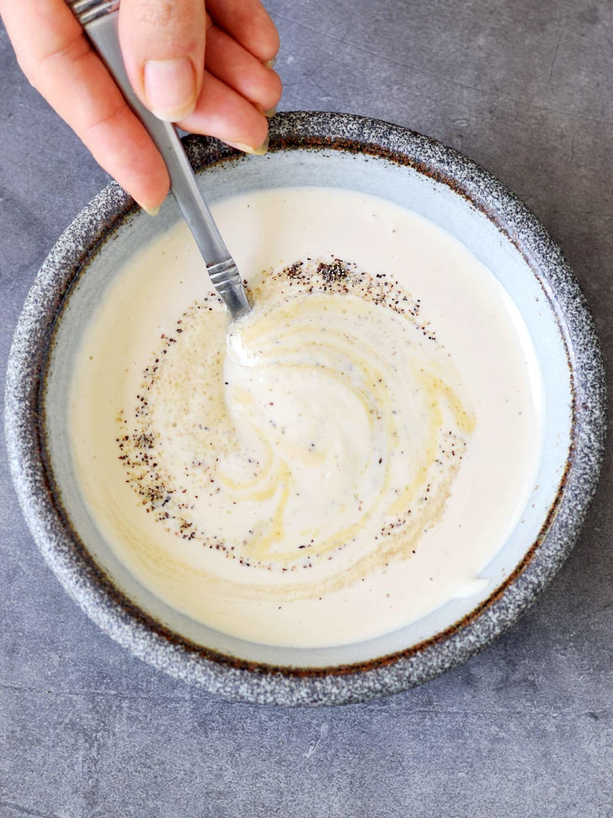 stirring dairy-free sour cream dressing