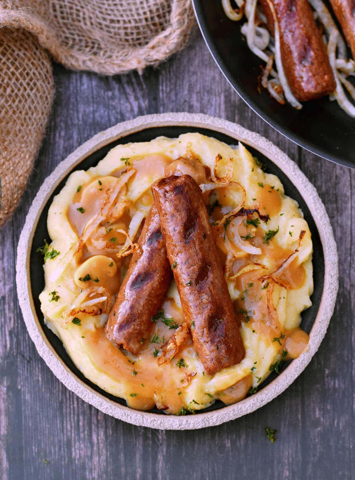 vegan sausage with mash and fried onions