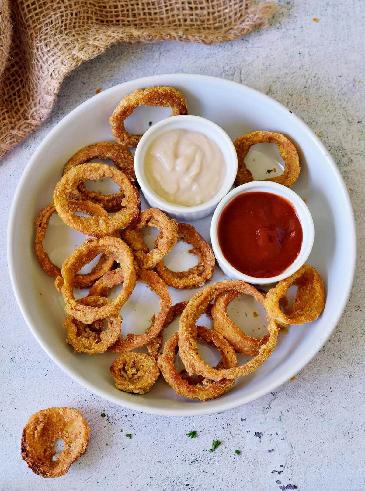 onion chips in bowl with 2 dips