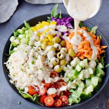 mediterranean rice salad with vegan dressing drizzle