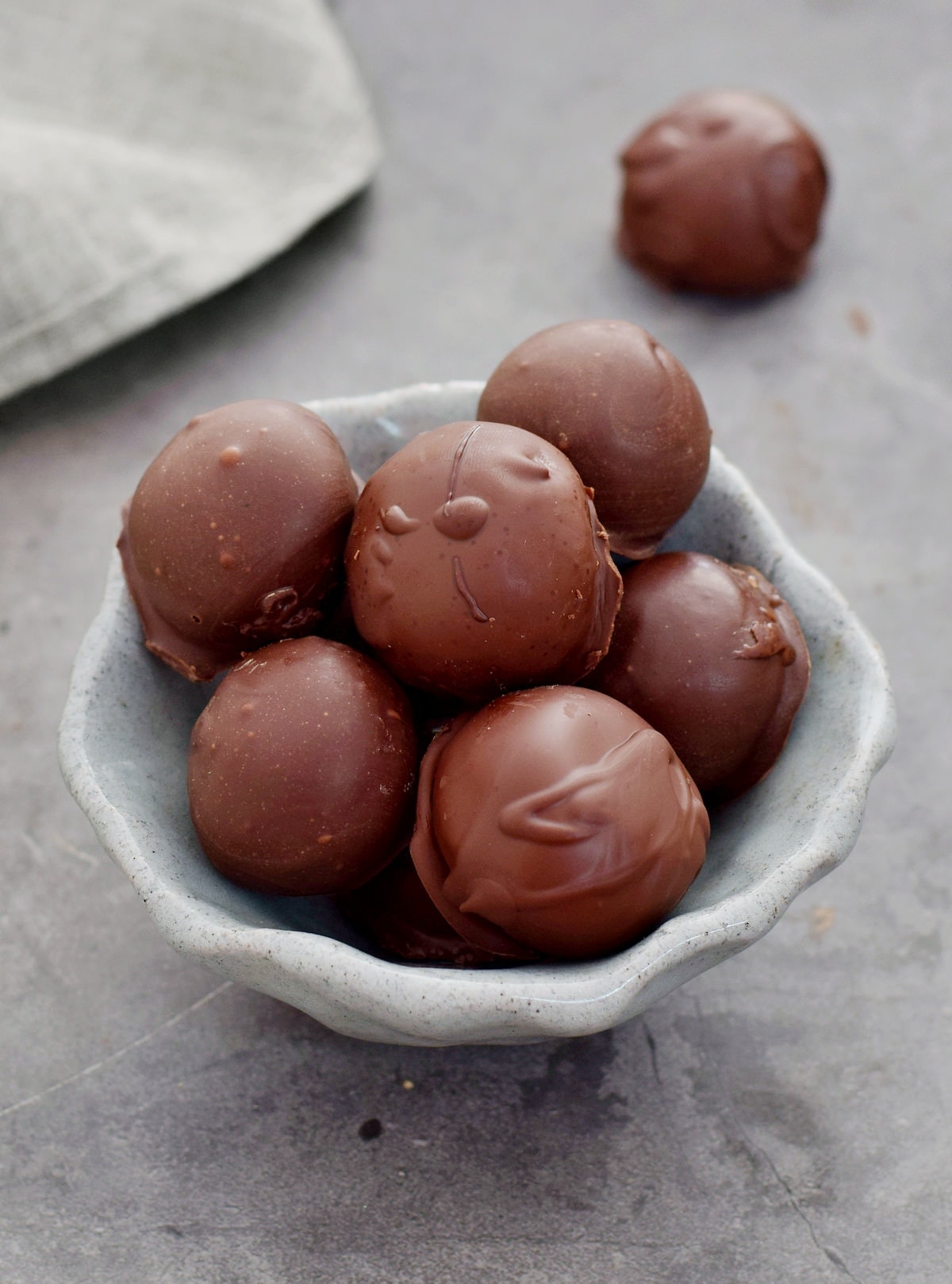 chocolate balls in gray ceramic bowl