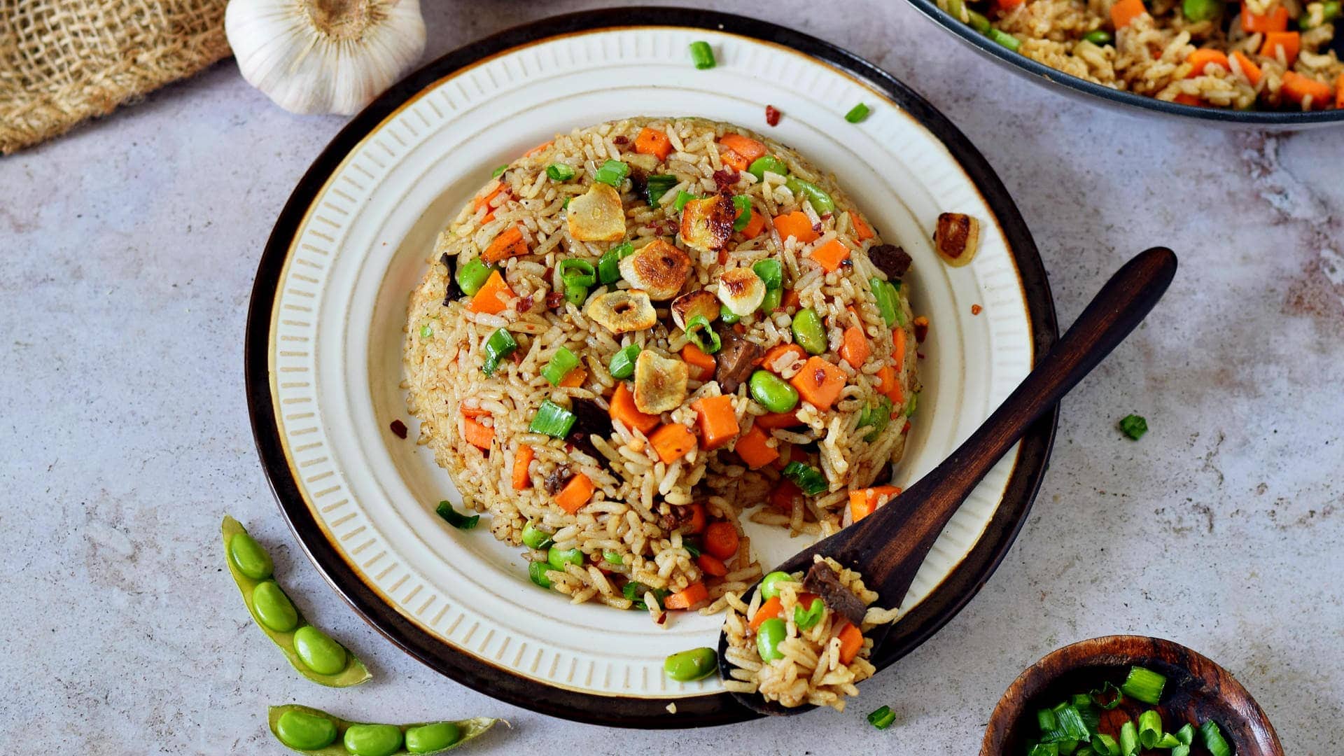 Japanese Hibachi fried rice with garlic and veggies on a plate