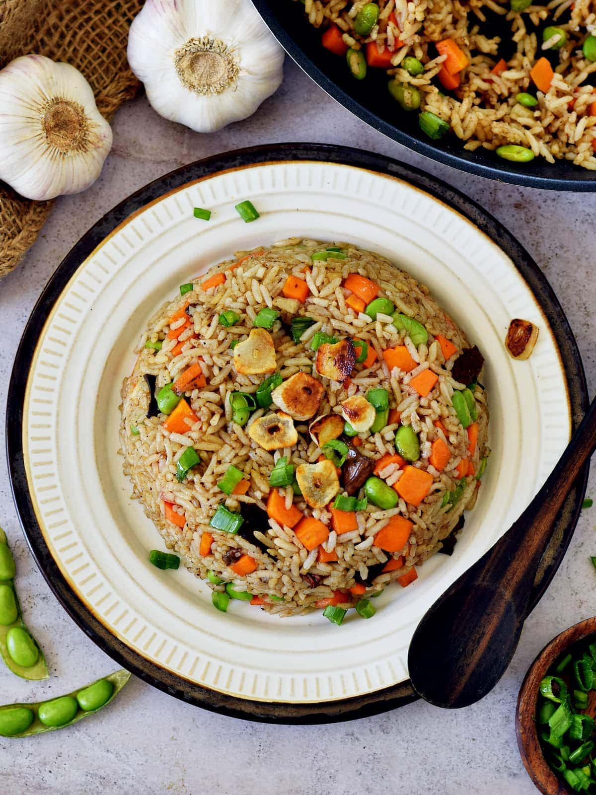 Japanese fried rice with veggies and garlic on plate