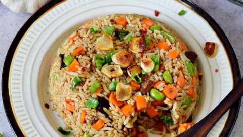 Japanese garlic fried rice with veggies on plate