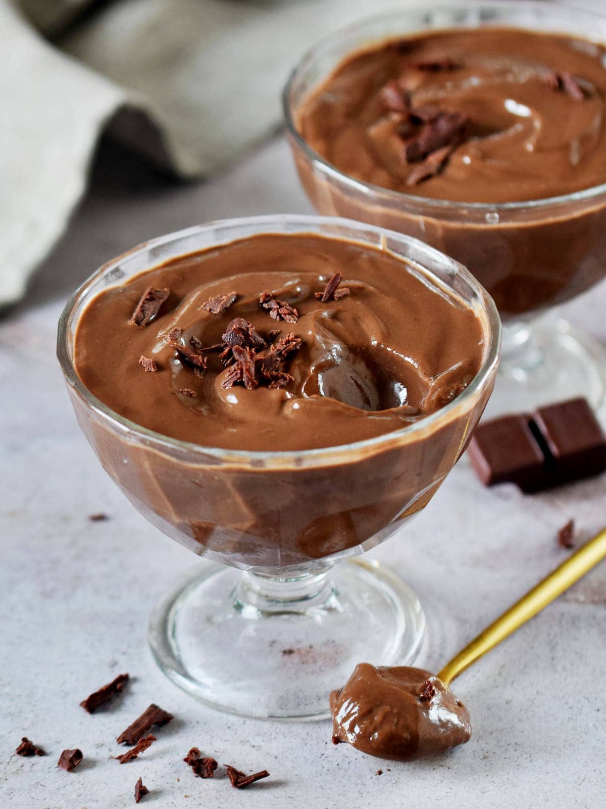 choc cream in 2 jars with spoon