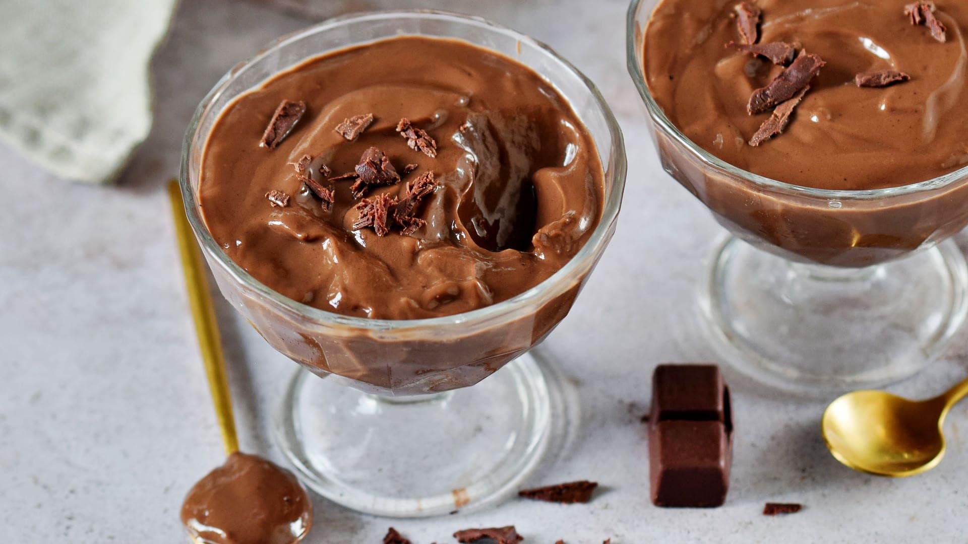 horizontal shot of vegan chocolate pudding in two jars