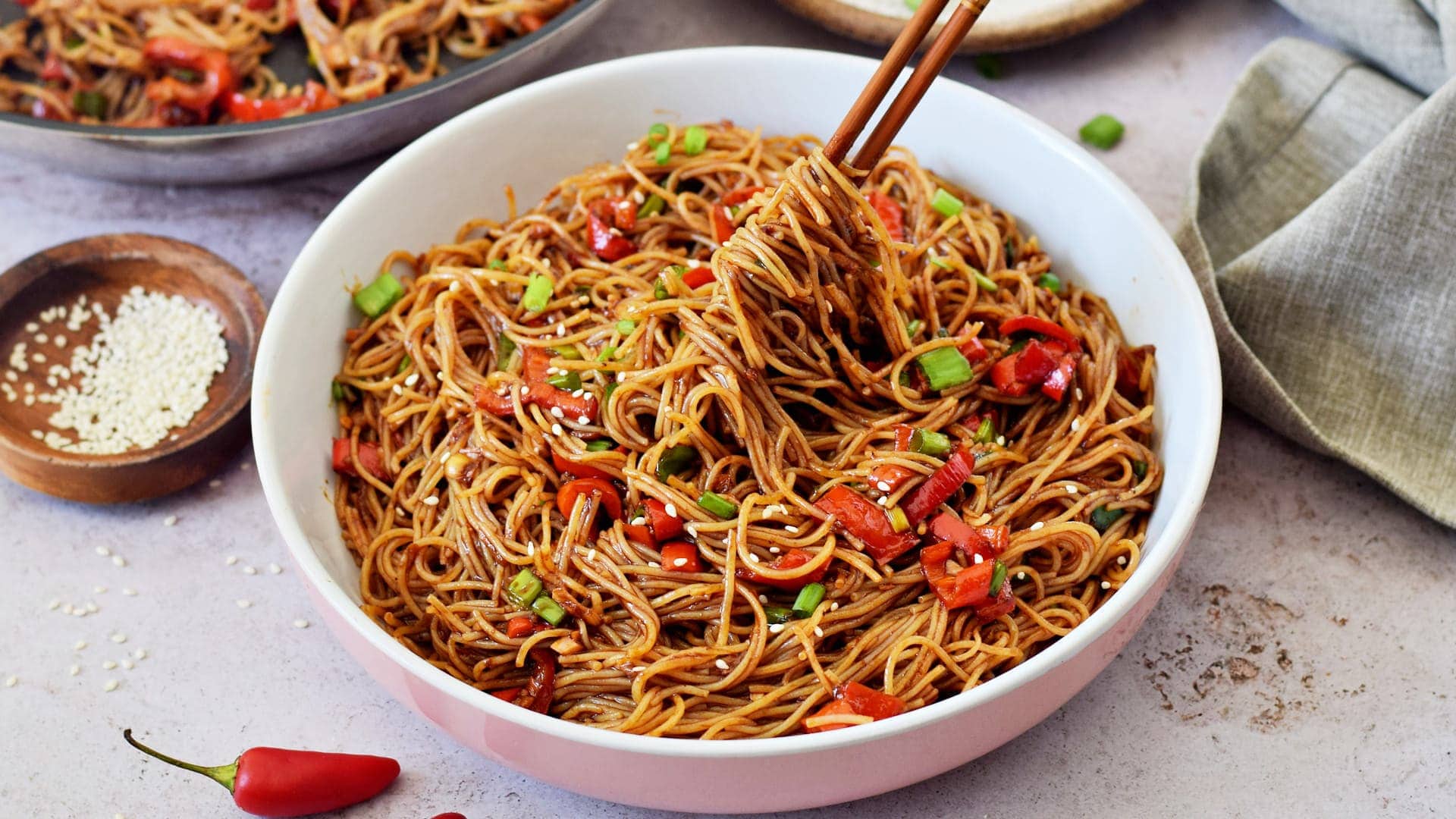 horizontal view of spicy thai noodles in bowl