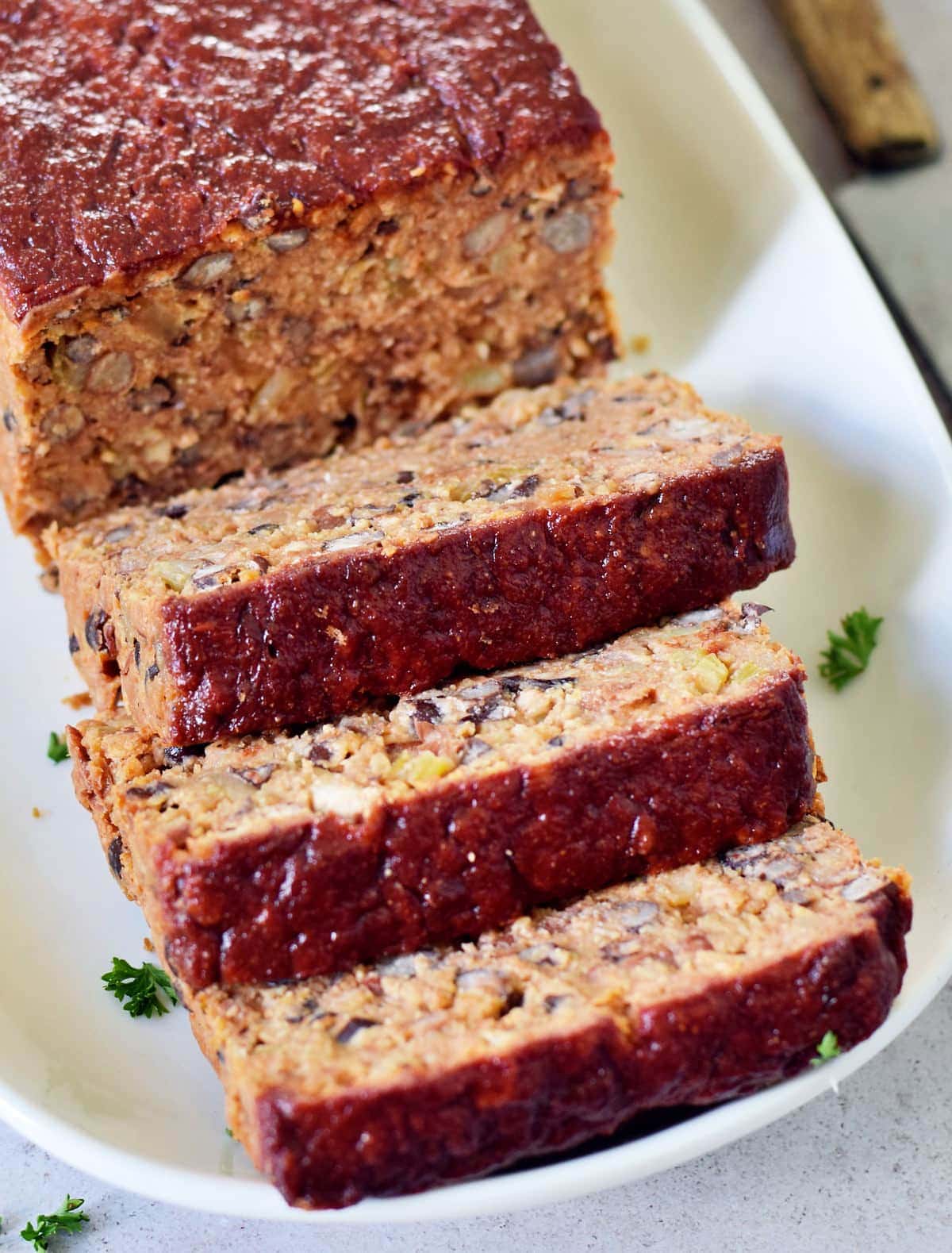 close-up of black bean meat loaf on white plate