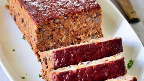 vegan meatloaf sliced on white plate