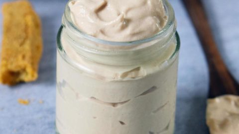 vegan mayo in jar with polenta fries in background