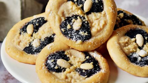 hand grabbing a homemade kolach