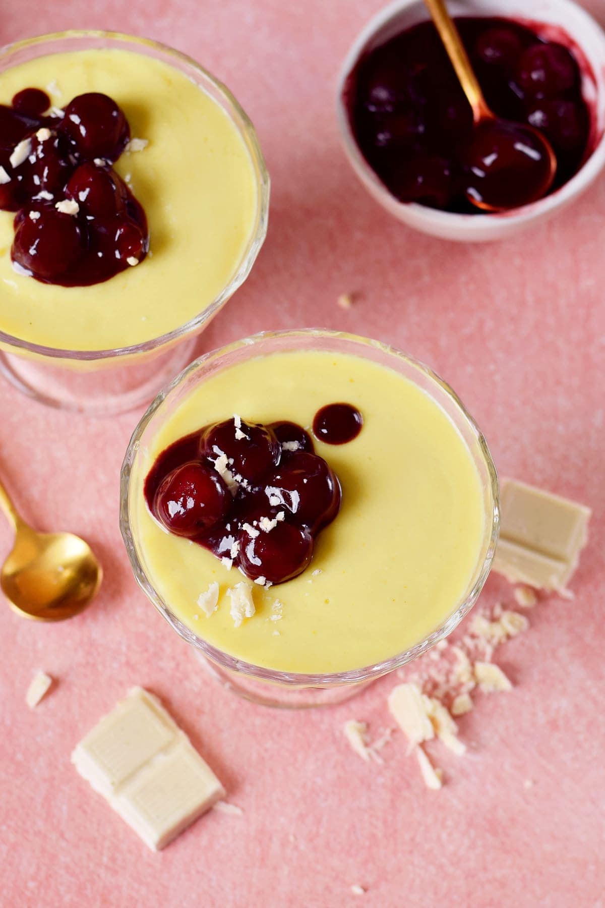 vegan custard in 2 glasses with cherry compote