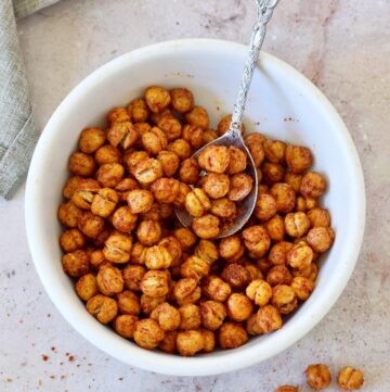 crispy air fryer chickpeas with spoon in white bowl