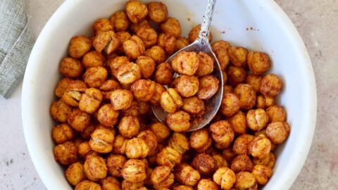 crispy air fryer chickpeas with spoon in white bowl