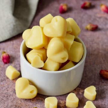 vegan white chocolate hearts in a small bowl