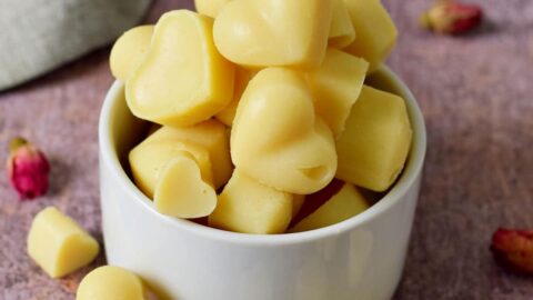 vegan white chocolate hearts in a small bowl