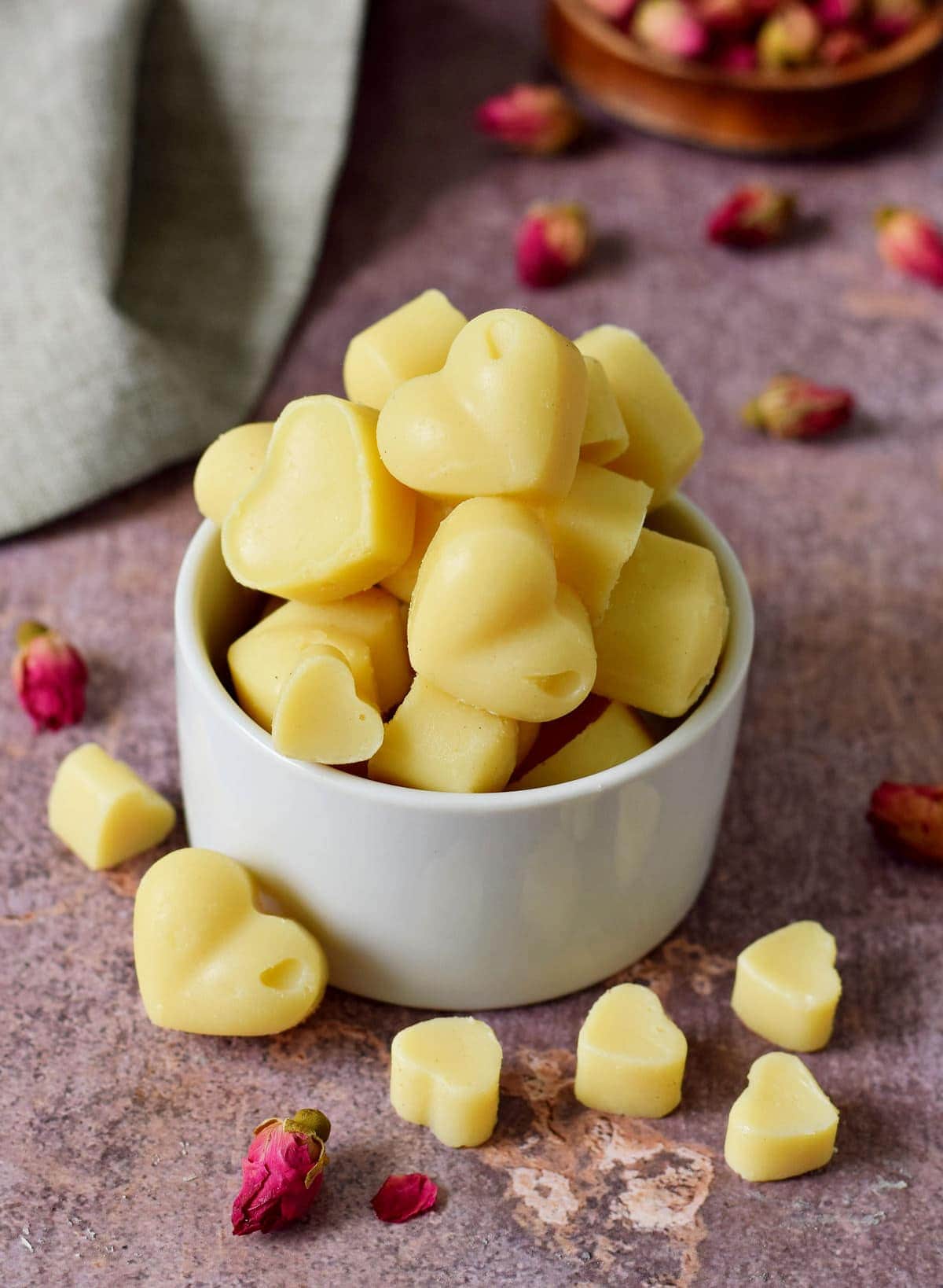 vegan white chocolate hearts in a small bowl