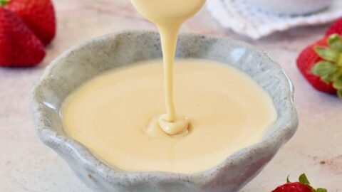 homemade vegan condensed milk in bowl with spoon
