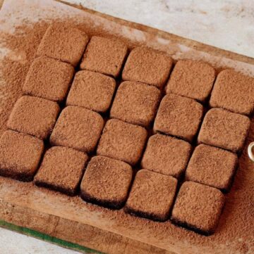cropped-homemade-condensed-milk-truffles-with-cocoa-powder-on-wooden-board.jpg