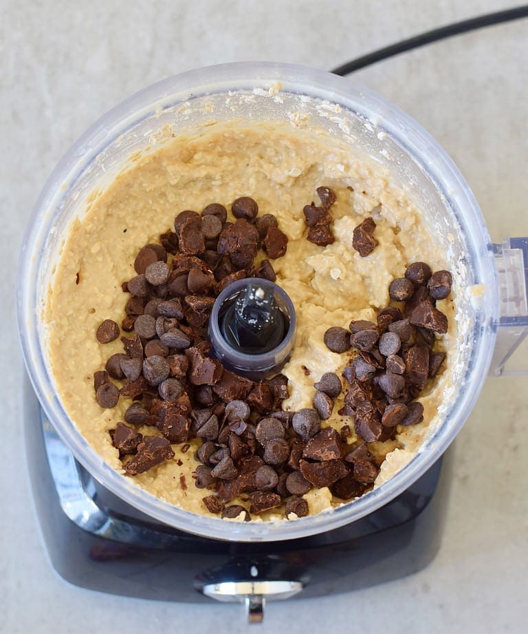 chickpea oat batter in food processor with chocolate