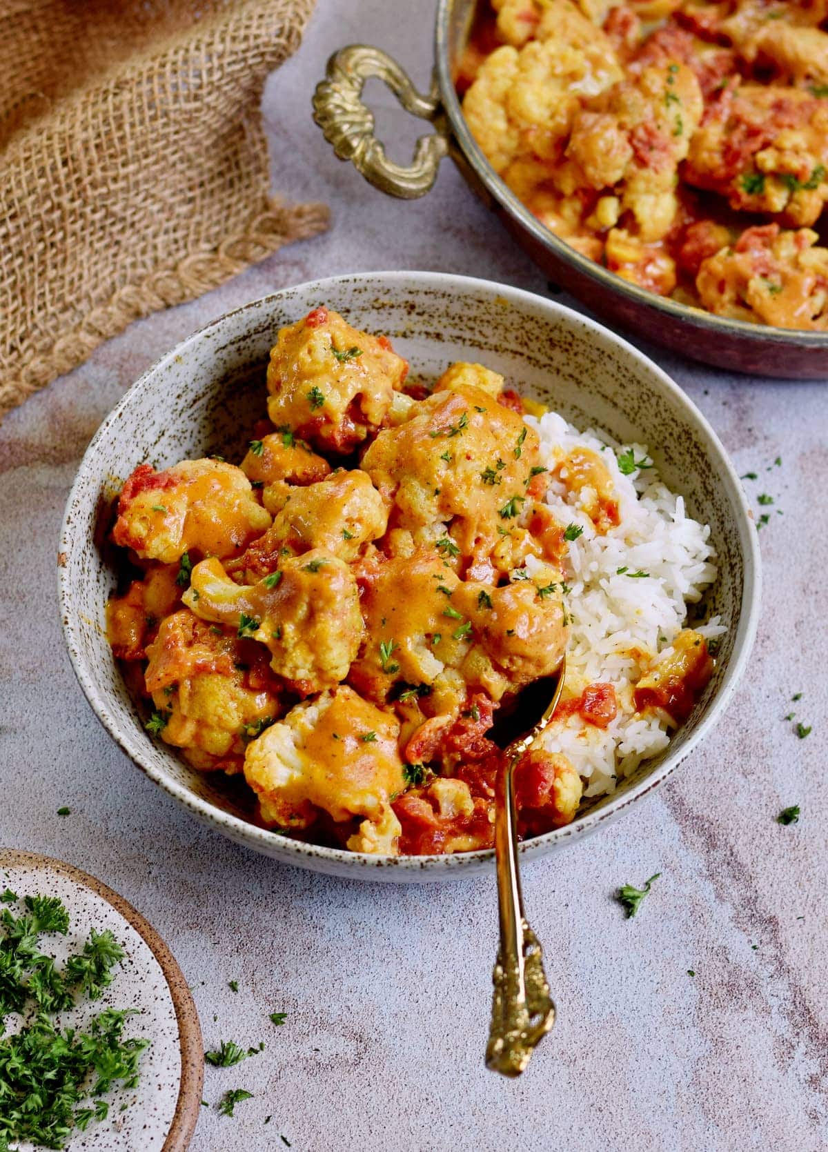 roasted cauliflower curry in bowl with rice