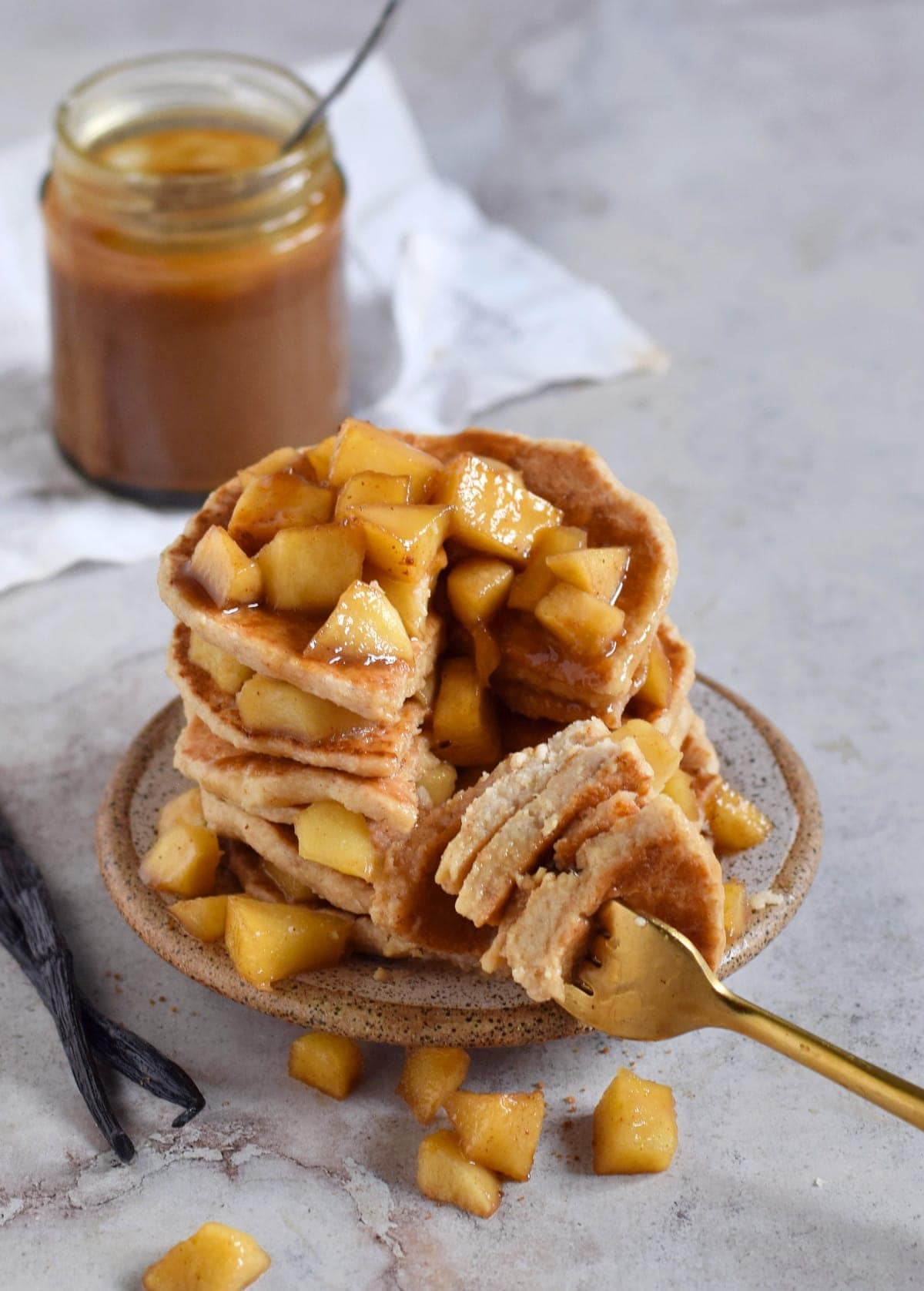 stack of apple pancakes with fork