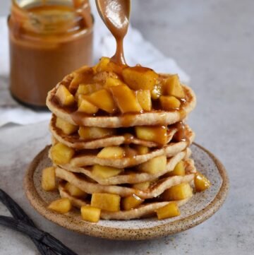 stack of applesauce pancakes with caramel sauce